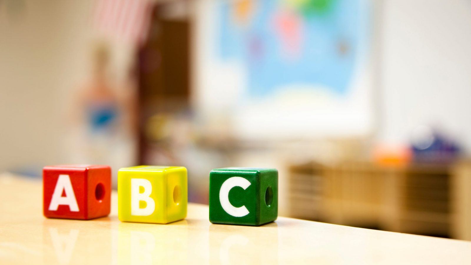 Letter blocks, a,b,c on table in classroom.  MORE LIKE THIS... in lightboxes below!